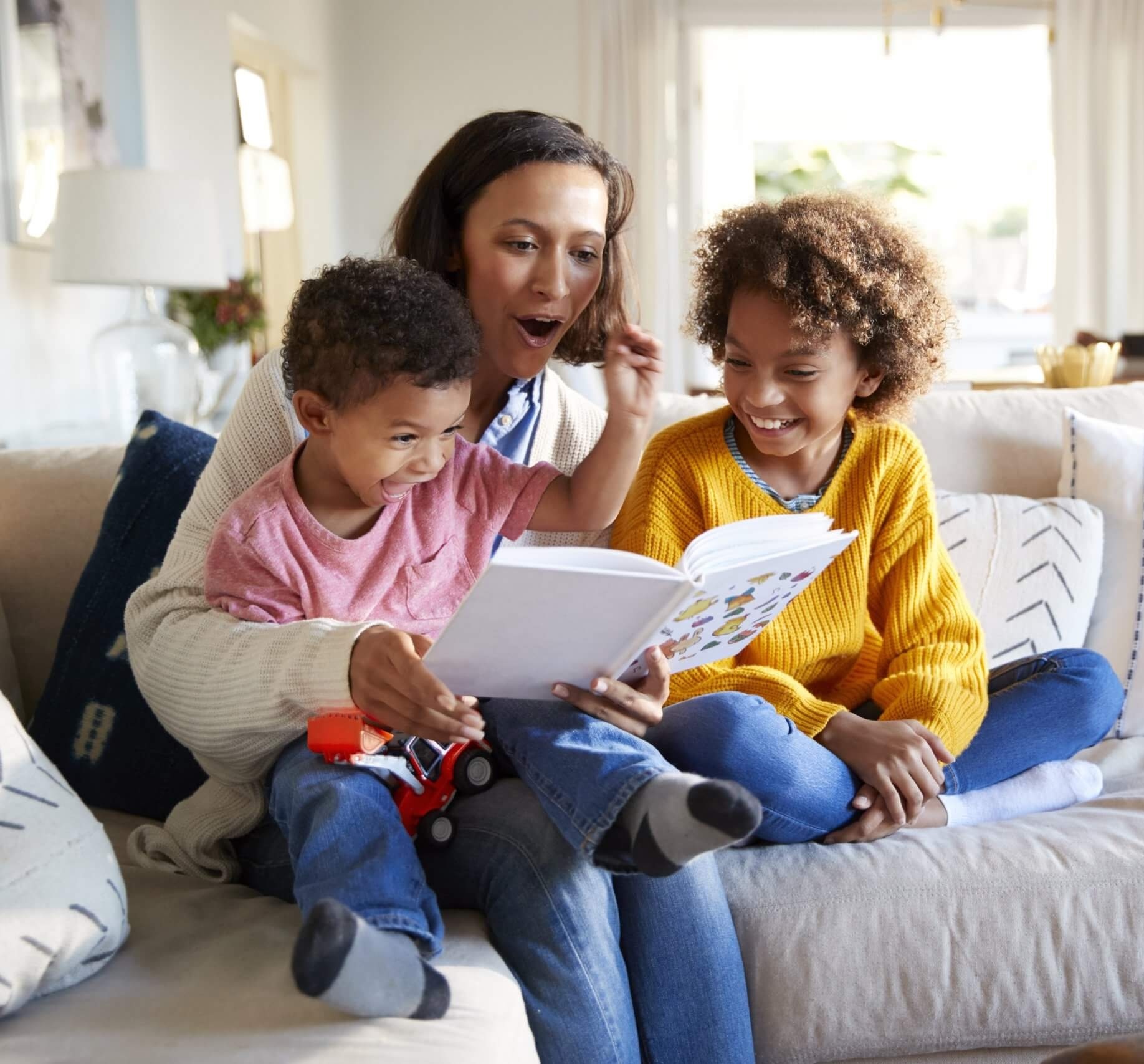 Family reading together on the couch